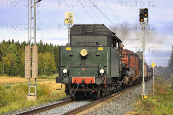 Hr1 class steam locomotive Ukko-Pekka 1009 pulling carriages between Urjala and Humppila, Finland. September 18, 2020