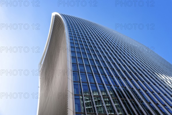 London, UK, May 14, 2019: Low angle view of 20 Fenchurch skyscraper in London agaisnt blue sky. Also known as Walkie Talkie building