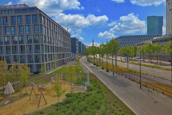 City view with playground and modern buildings under a clear blue sky, street scene, Pfingstweidstrasse, Zurich, Zurich West, Canton of Zurich, Switzerland