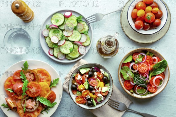 Fresh vegetarian salads, overhead flat lay shot of an assortment. Variety of plates and bowls with green vegetables. Healthy food, top shot, with olive oil, Food photography, Food photography