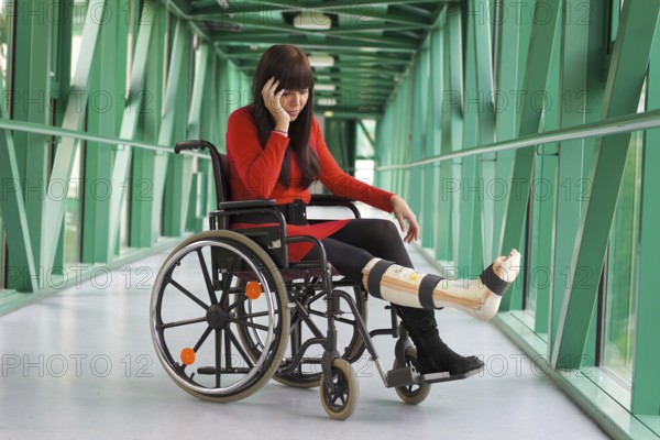 Young woman with plaster leg, Austria