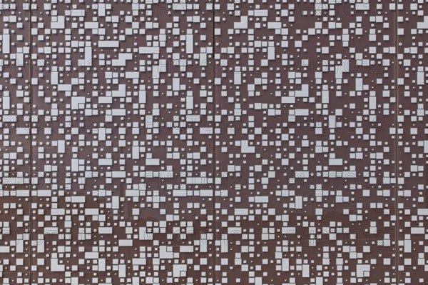 Closeup of randomly placed white tiles on painted concrete wall background texture