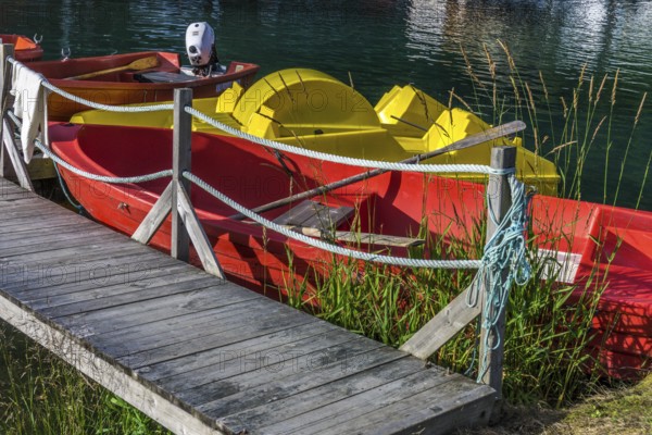Colourful boats on a lake in Norway