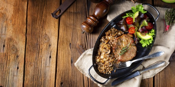 Pork steak with mushrooms and buckwheat groats and mango salad