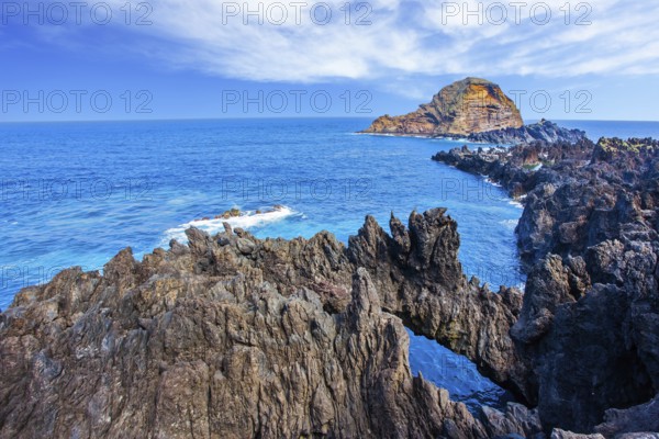 Volcanic island of Madeira. Fantastically beautiful coast. Rocks and grottoes of the Atlantic coast. The concept of exotic and ecological tourism
