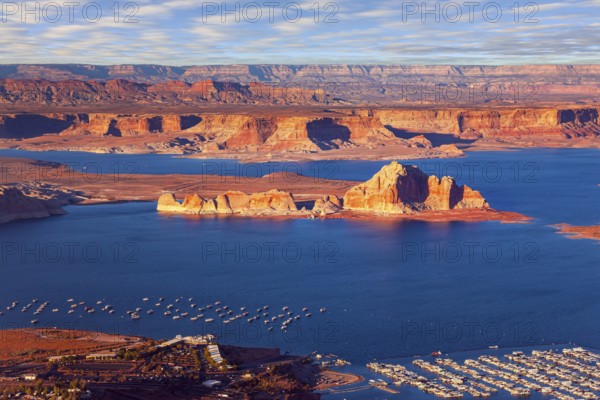 USA. Lake Powell is a reservoir on the Colorado River. The blue water of the lake contrast with the red-brown massifs of the surrounding rocks. The photos were taken from the plane