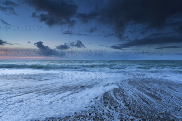 Ocean waves in dusk, Normandy, France