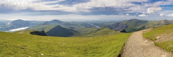 Walking down from Mount Snowdon on the Llanberis Path, Snowdonia, Gwynedd, Wales, UK, looking north towards the Clogwyn station, Llyn Padarn and Llanberis