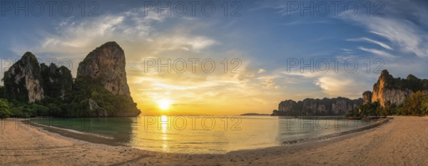 Tropical islands sunset view with ocean sea water and sand beach at Railay Beach, Krabi Thailand nature landscape panorama