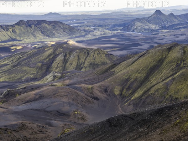 View from Mount Sveinstindur, volcanic landscape, moss-covered hills, mountains, Icelandic highlands, Iceland