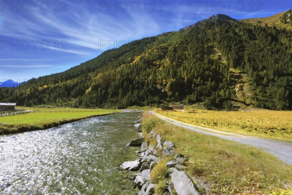 Headwaters of the famous Krimml waterfalls. Crystal clear water glows in the midday sun. Austrian Alps
