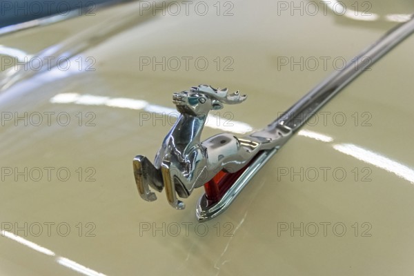 Moscow, Russia, November 10, 2018: The classic emblem of the Volga GAZ M-21 cars, a figure of a running deer on the hood