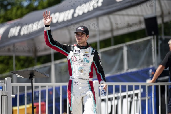 Chandler Smith walks across the stage during driver intros prior to the Road America 180 at Road America in Elkhart Lake WI