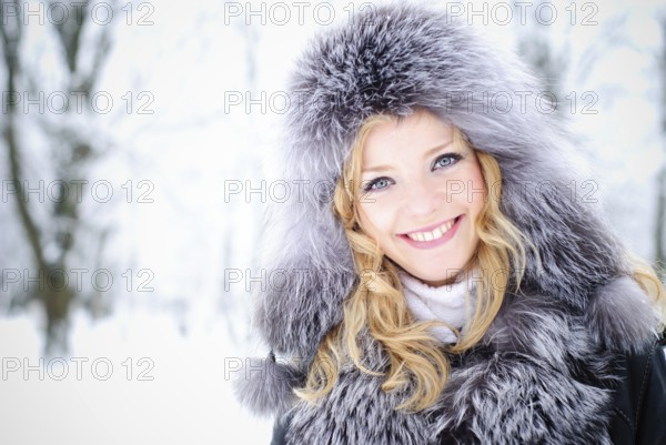 Blond woman outdoors in winter day