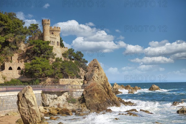Beautiful view on Castell d'en Plaja from seaside in Lloret de Mar, Costa Brava, Spain. Sunny summer day in Lloret de Mar. Rocky coastline in spanish beach