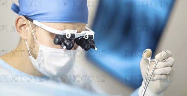 Medical professional using tools during a surgical procedure
