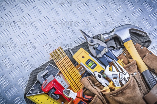 Tool belt with construction objects on corrugated metal pattern building concept