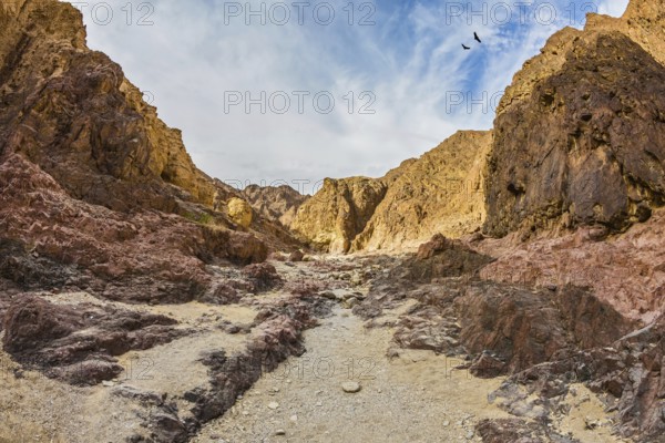 Israel in January. Multicolor and picturesque Black canyon in ancient mountains of Eilat