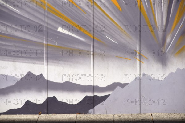 Frankfurt, Germany - August 11, 2018: The drawing of mountains and stylised sunbeams by an unknown artist at Frankfurt Airport on August 11, 2018 in Frankfurt, Germany