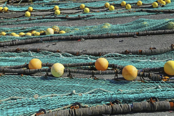 Fishing nets in the port of Loctudy, Finistere, Brittany, France spreading for drying Fishing nets in the port of Loctudy, Brittany, France spreading for drying