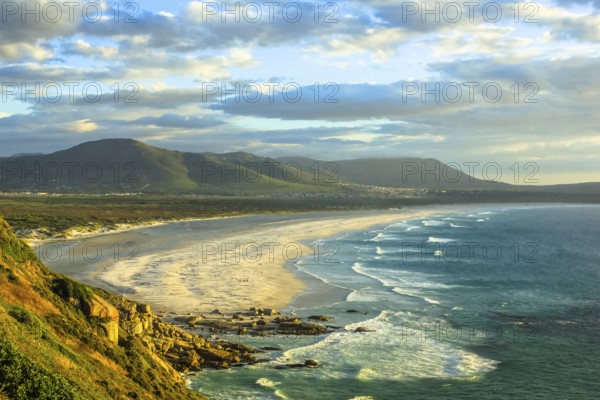 Spectacular aerial view of Noordhoek Beach, Table Mountain National Park, South Africa. Noordhoek Beach is the 8 km long strip of sandy beach and safari starts from the famous Chapmans Peak Drive and up to Kommetjie Slangkop Lighthouse