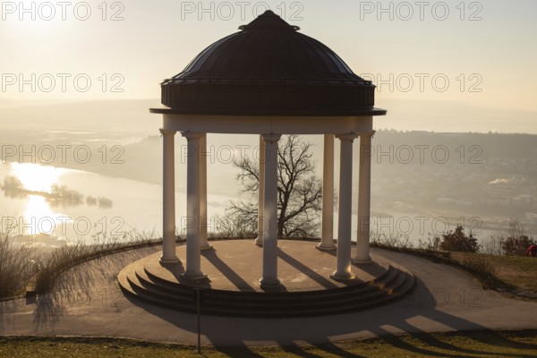 Beautiful temple in a landscape shot. Sunrise on a winter morning. Beautiful view along the Rhine at the Niederwaldtempel, Niederwalddenkmal, Hesse, Germany