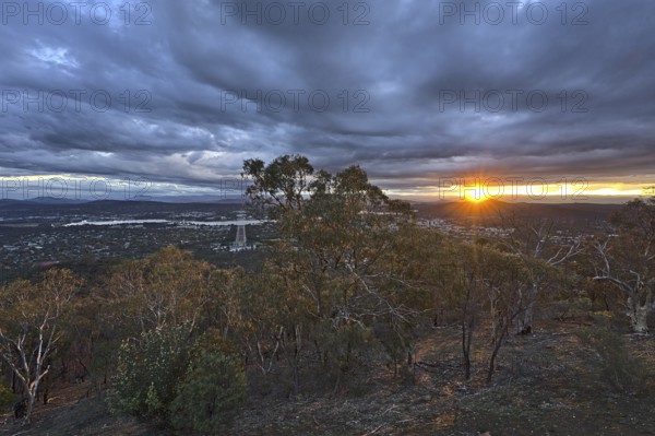 Canberra at night from Mount Ainslie Lookout and with the setting sun
