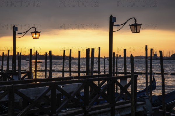 Morning atmosphere, gondola jetty, dawn over the lagoon, Venice, Veneto, Italy