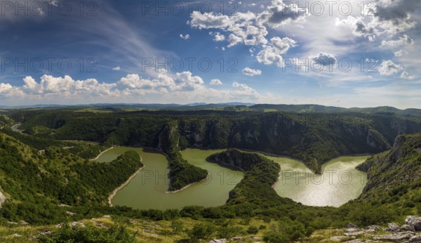 Panorama of meanders at rocky river Uvac gorge on sunny day, southwest Serbia
