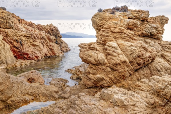 Rugged rocky coast of the Plage de Stagnoli on the Mediterranean Sea, Gulf of Sagone, west coast of Corsica, Corsica, France