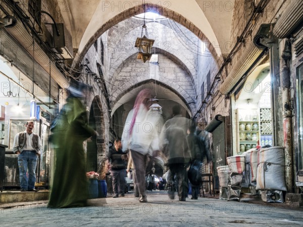 Busy souk market shopping street in old town of aleppo syria