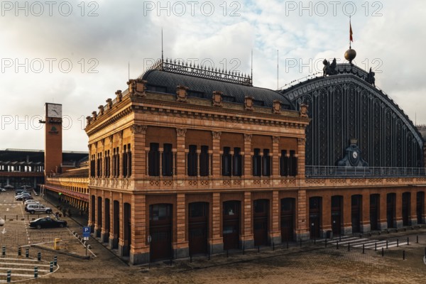 Madrid, Spain, October 27, 2018: Exterior view of old Atocha Railway Station at sunrise