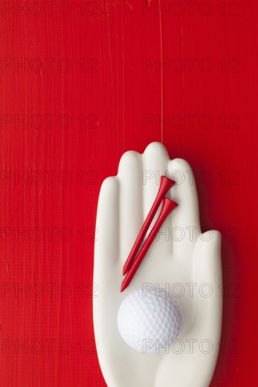 Detail of artifical hand with golf equipments - Flat Lay Photography