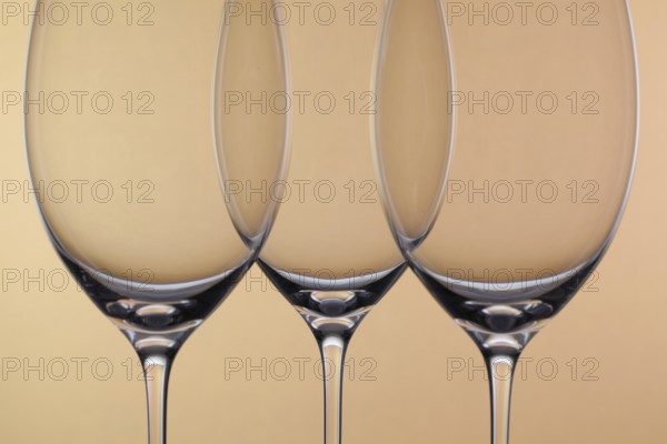 Three empty glasses of wine on a background