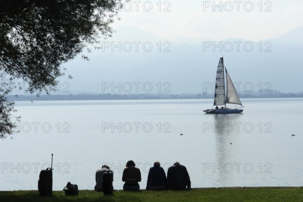 Small group of travellers waiting for the ship to arrive