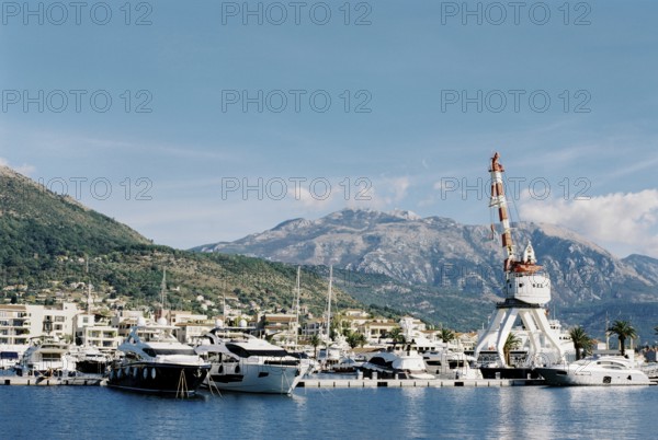 Crane on a platform near the marina in Porto. Montenegro.