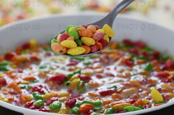Prepared breakfast with colorful puffed rice with spilled rice in the background