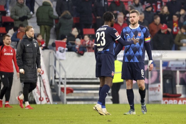 Disappointed after the final whistle and the 0:1 defeat, the Heidenheim players Omar Traoré (FC Heidenheim) and Patrick Mainka (FC Heidenheim), during the match of the 1st FBL: 24-25: 21. Sptg. SC Freiburg - 1. FC Heidenheim DFL REGULATES PROHIBIT ANY USE OF PHOTOGRAPHS AS IMAGE SEQUENCES AND/OR QUASI-VIDEONan Photo: Joachim Hahne/johapress, Freiburg, Germany / Germany