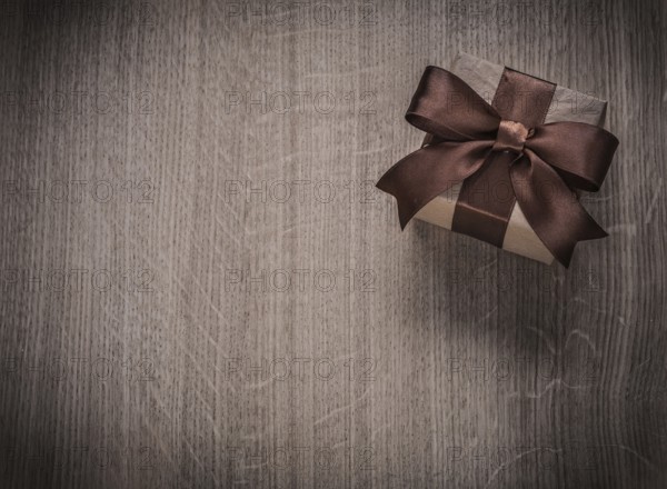 Vintage gift box on wooden board holiday concept