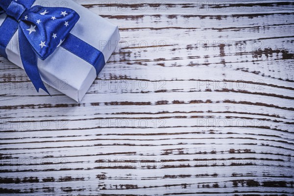 Packed present on vintage wooden board greeting card holidays concept