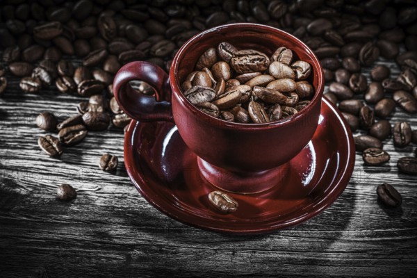 Coffee grains cup saucer on wooden board