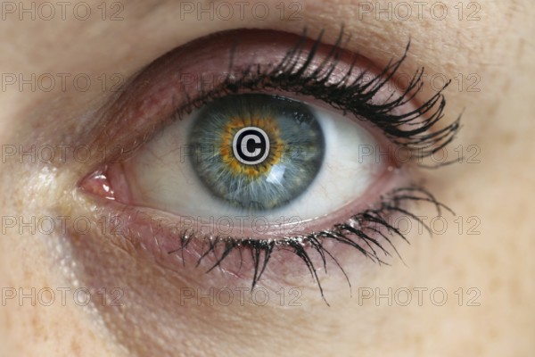 Eye with copyright sign in the pupil concept
