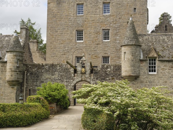 An old castle with stone walls, towers and an entrance surrounded by green plants, inverness, scotland, Great Britain