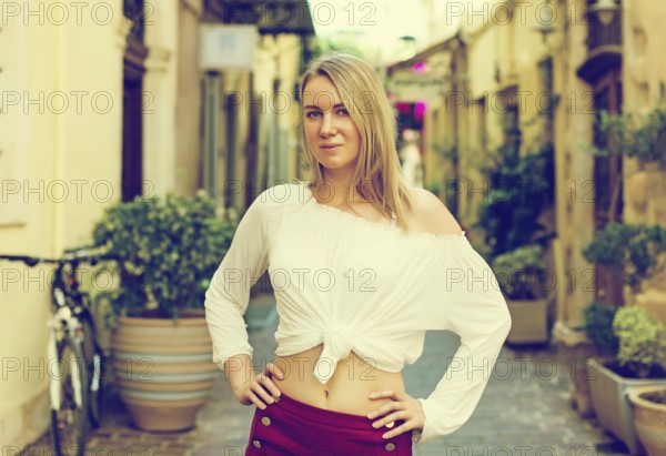 Pretty woman posing on the street. Place for text