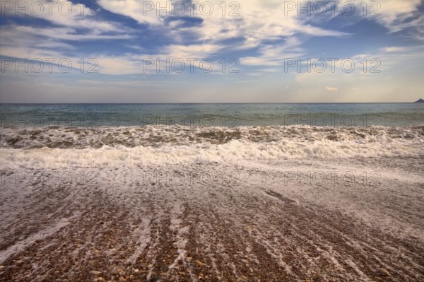 Sea surf foamy beach wave nearby
