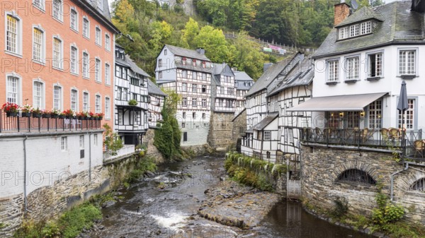 Cityscape of Monschau in autumn colors. Town in western Germany known for its medieval center, with half-timbered houses and narrow cobblestone streets