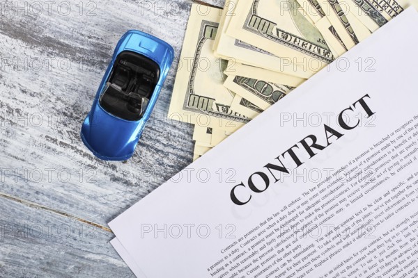 Car documents and currency. Conclusion of purchase agreement
