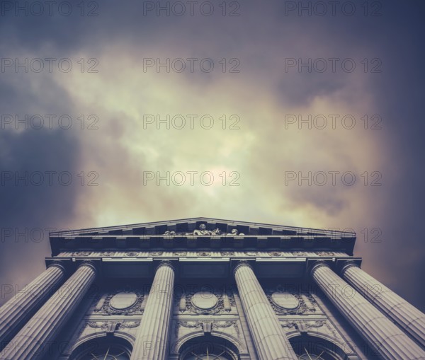 Retro Vintage Style Image Of A City Hall Or Courthouse Against A Stormy Sky