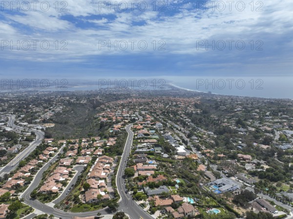 Aerial view over La Jolla Hills with big villas and ocean in the background, San Diego, California, USA