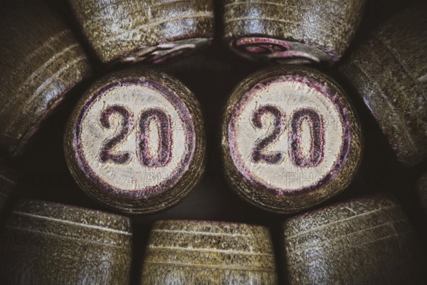 Vintage wooden lotto kegs two numbers 20 and 20 as symbol of 2020 year. Close-up top view of 2020 New Year inscription in circle. Vignette, trendy brown toning, vintage instant color photo effect